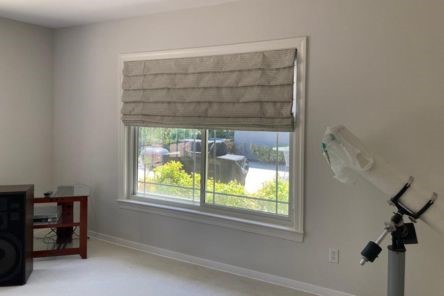 Roman blinds for windows offering privacy and style in Fremont home office, shown half closed