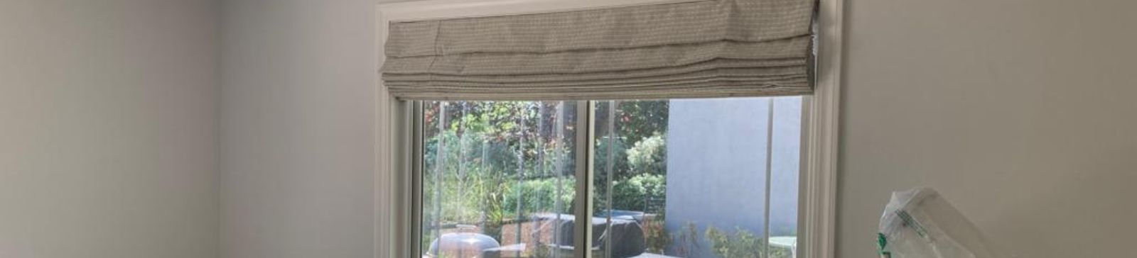 Roman blinds for windows offering privacy and style in Fremont home office, shown half closed